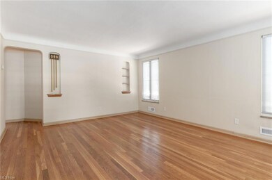 View of large living room with beautiful hardwood floor