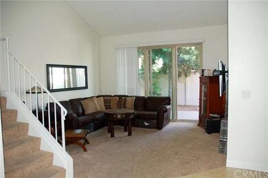 Living room with sliding doors to out door patio. 