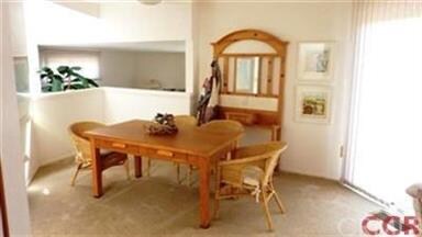 Dining area is adjacent to the kitchen with slidin