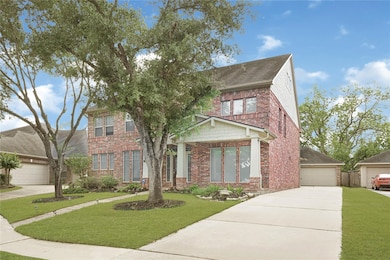 Extended 2-car detached garage offers ample storag