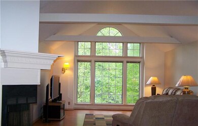 Leave the blinds up and let the light in.  Total privacy with all the trees out front.