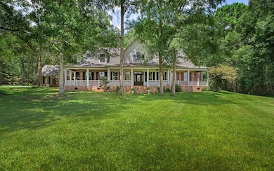 Acadian style with gorgeous wrap around front porch.