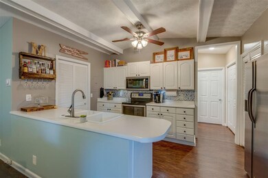 On trend white cabinetry with new appliances (stov