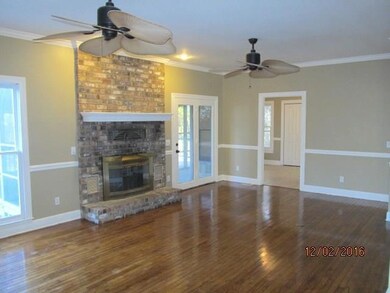 Appealing fireplace, ceiling fans, and lots of recessed lighting.