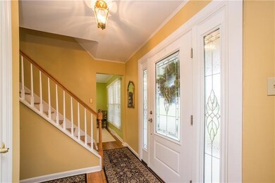 Natural light entering from the front door adds to