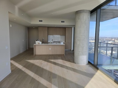 Kitchen with expansive windows, modern cabinets, 