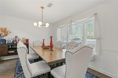 Dining room featuring an inviting chandelier, base
