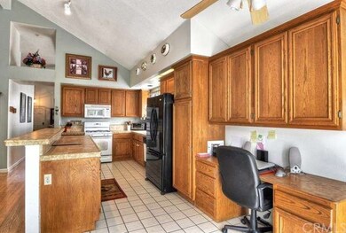 The kitchen has updated countertops, a built-in of