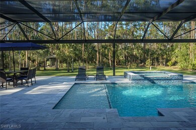 View of pool with a pool with connected hot tub, g
