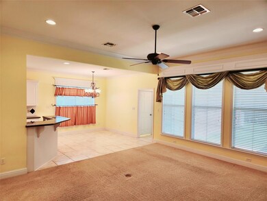 Living room view into breakfast area and kitchen