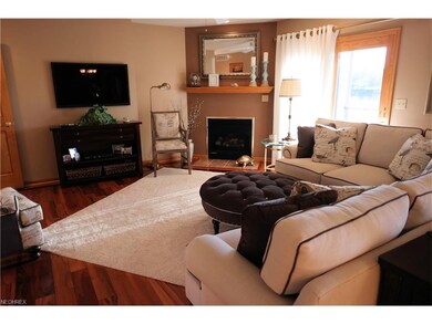 Living Room with Fireplace, hardwood floors, glass