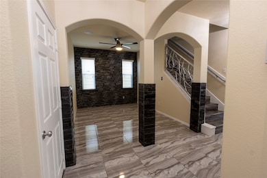 Arches through out the living room and foyer.