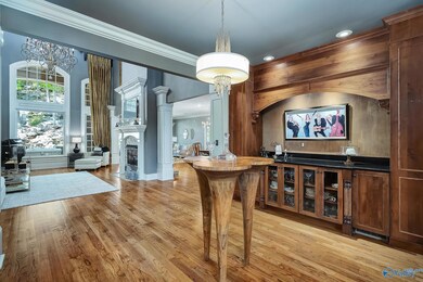 Greet your guests in style with an impressive beverage service, just off of the main foyer.