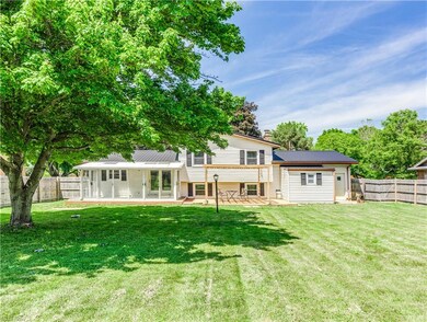 The backyard is large and fenced-in and had a big 