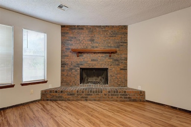 Unfurnished living room with wood-type flooring, a