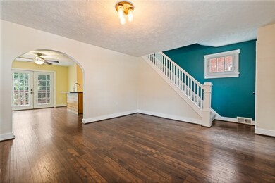 The Living Room Opens To The Dining Room, Too.