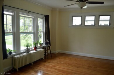 Spacious formal dining room with hardwood floor.