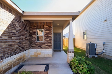 Entrance to property with brick siding