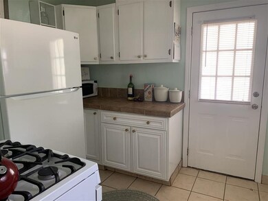 Updated kitchen with gas range. All appliances rem