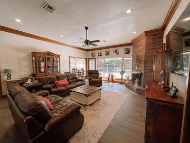 Large open concept living room with corner firepla