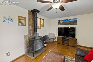 Cozy and inviting, the living room centers around a wood-burning fireplace—perfect for cool mountain nights.