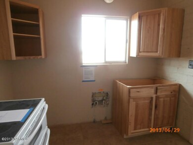 Kitchen w/new cabinets being installed