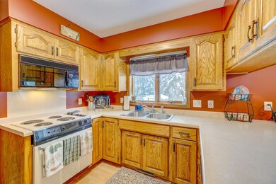 Kitchen is just off the garage entrance and looks out into the back yard.
