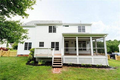 Rear entrance to home through screened porch
