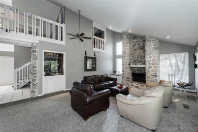Open large family room with wet bar and vaulted ce