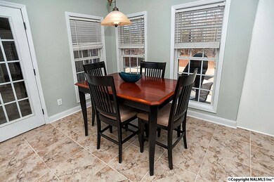 Open flowing room with large windows.
