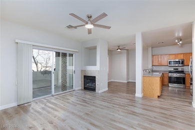 Kitchen featuring baseboards, appliances with stai
