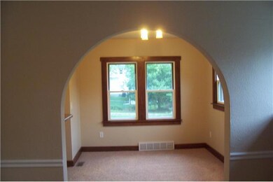 Exterior Front. Arched doorway to dining area.