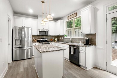Kitchen featuring appliances with stainless steel finishes, light wood finished floors, backsplash, and recessed lighting