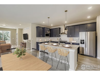 KITCHEN WITH A SLIDE IN GAS RANGE, HOOD VENT, SOFT CLOSE CABINETS