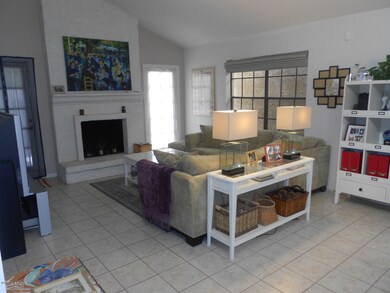 Family room has cozy fireplace