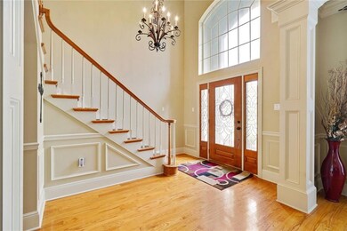 Enter through tall leaded glass door.  Wood floors