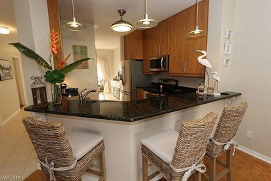 Kitchen featuring light tile patterned floors, kit