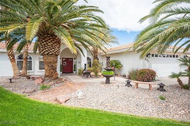 View of front of house featuring a tile roof, a ga