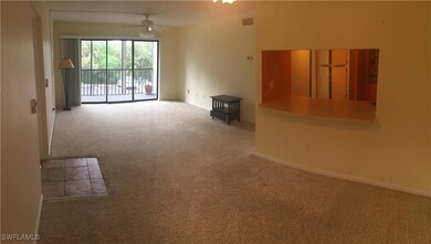 Unfurnished living room featuring ceiling fan and