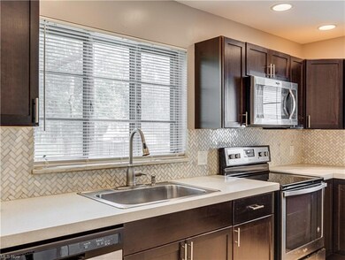 Kitchen with appliances with stainless steel finis