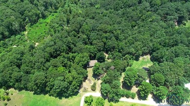 View of property location featuring a heavily wooded area