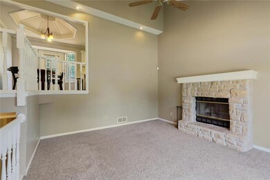 Second View of Great room. Open staircase to Kitch