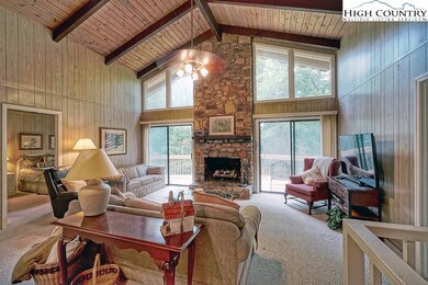 Floor to ceiling stone gas log fireplace