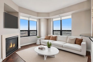 Light pouring into the open floorplan with panoramic city views.