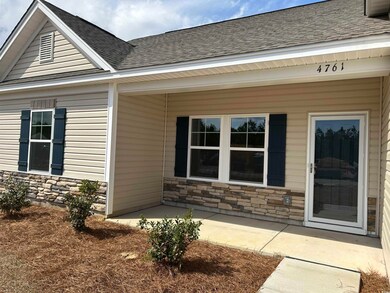 Entrance to property featuring stone siding and a 