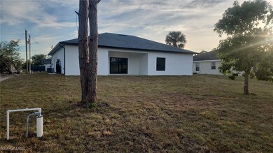 Property exterior at dusk with a lawn