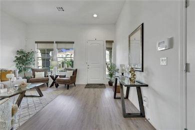 Entryway featuring wood finished floors and recess