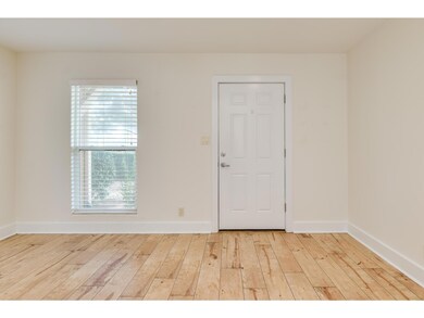 Spare room with hardwood / wood-style floors and 