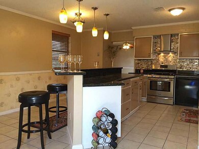 Kitchen. Eat-in kitchen with bar and stools.