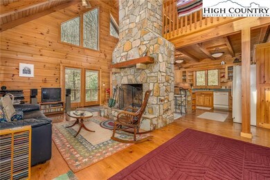 This log home features solid beams, tongue and gro